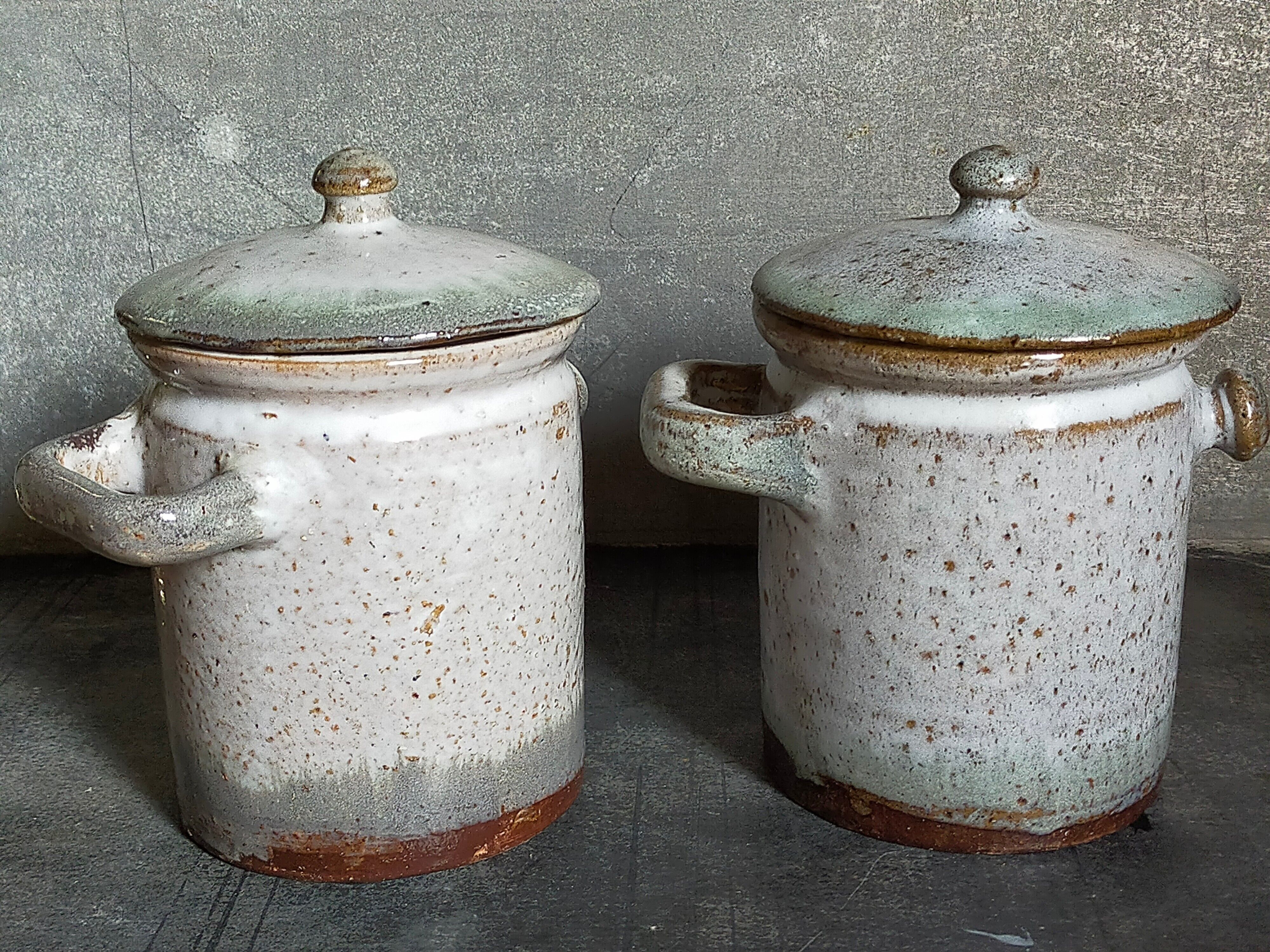 Duo of potter's pots covered in vintage glazed stoneware
