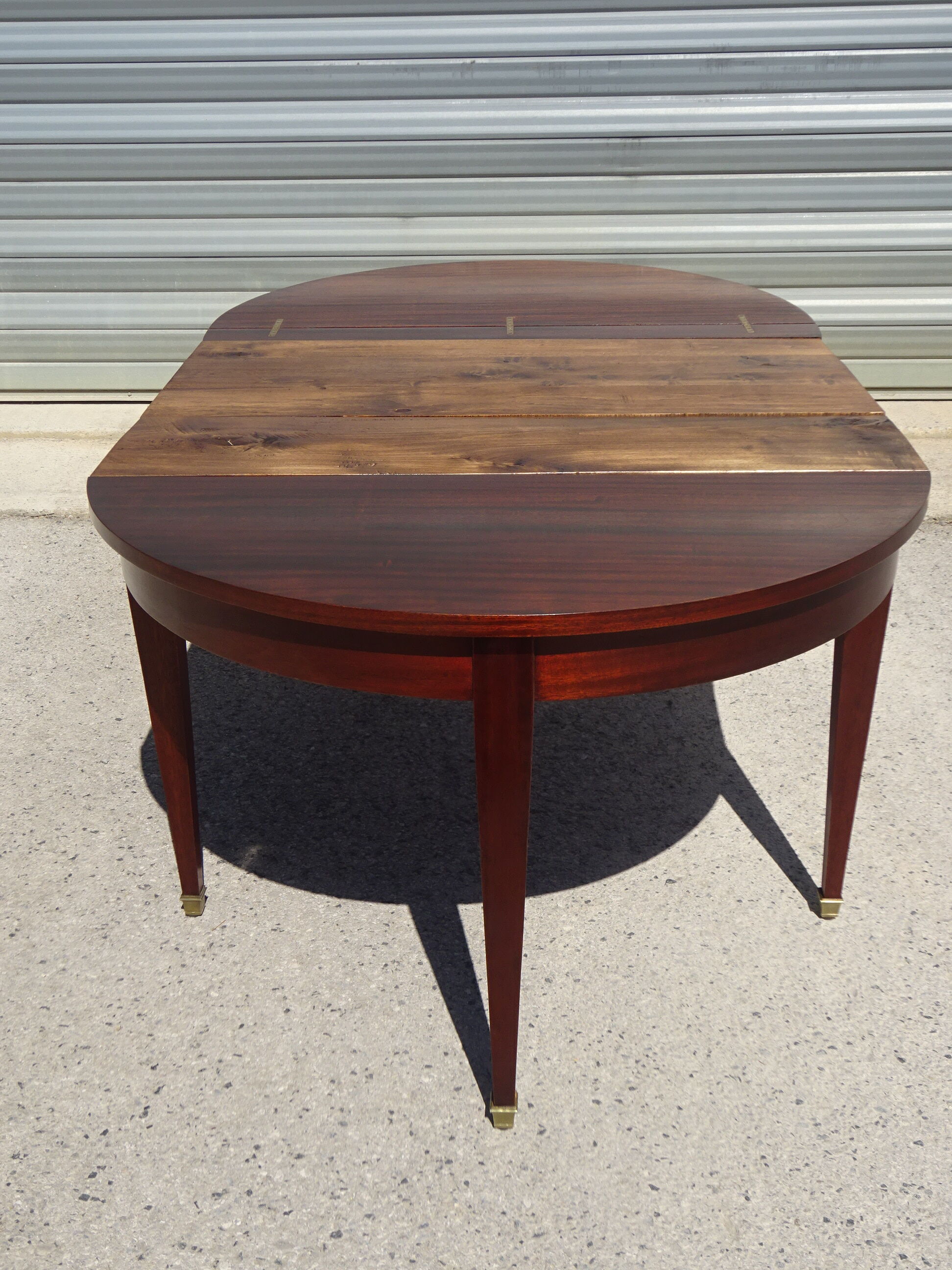 Half-moon console table, extendable in Empire style.