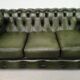 Three-seater green leather Chesterfield sofa