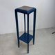 Blue side table with a veined stone top and a low shelf in the Art Deco style.