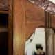 Old solid wood wardrobe with three vintage mirror doors