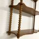 Vintage turned wood wall shelf with 3 levels.