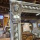 Beige patinated mirror with women's heads