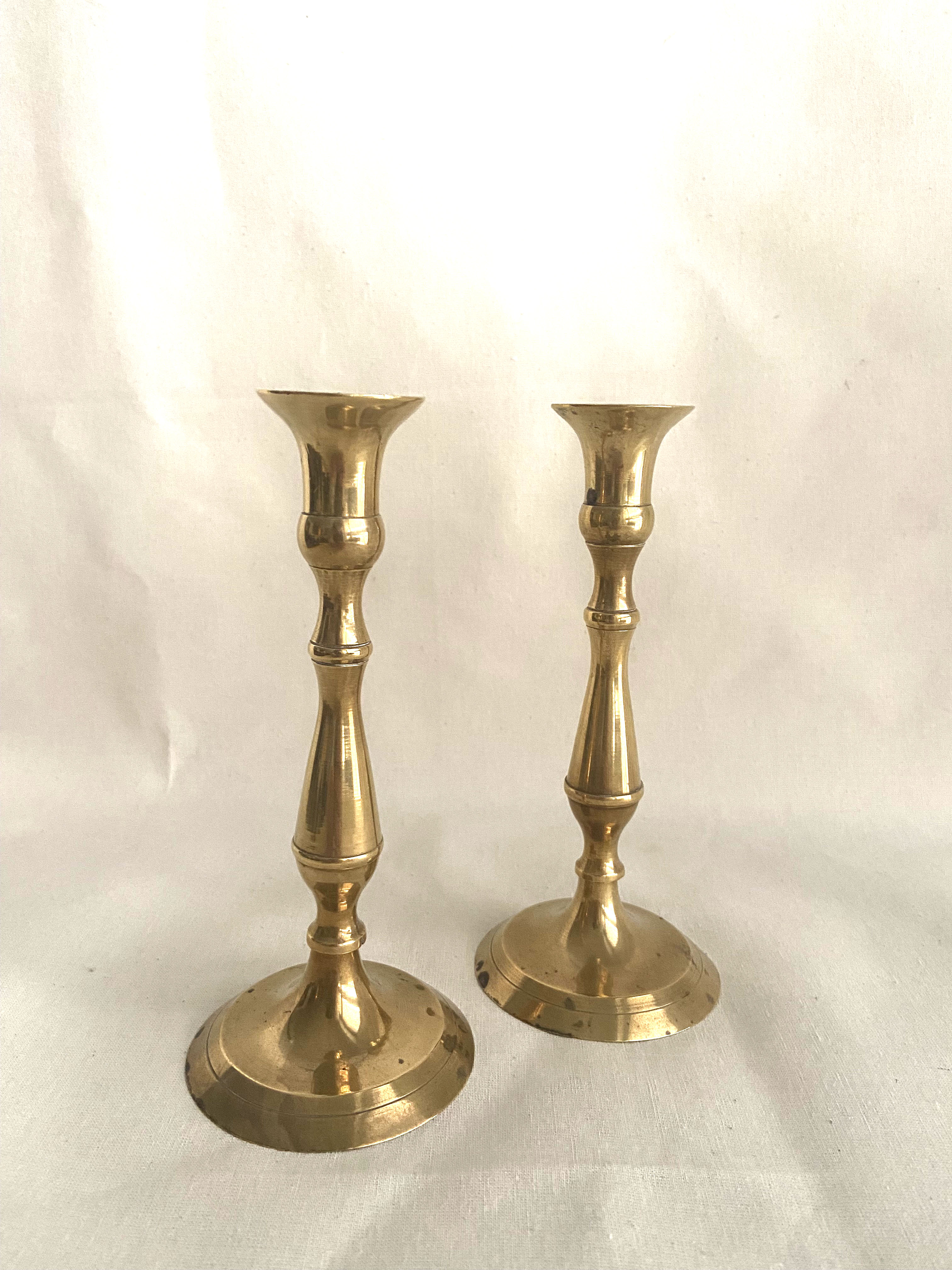 Duo of brass candle holders