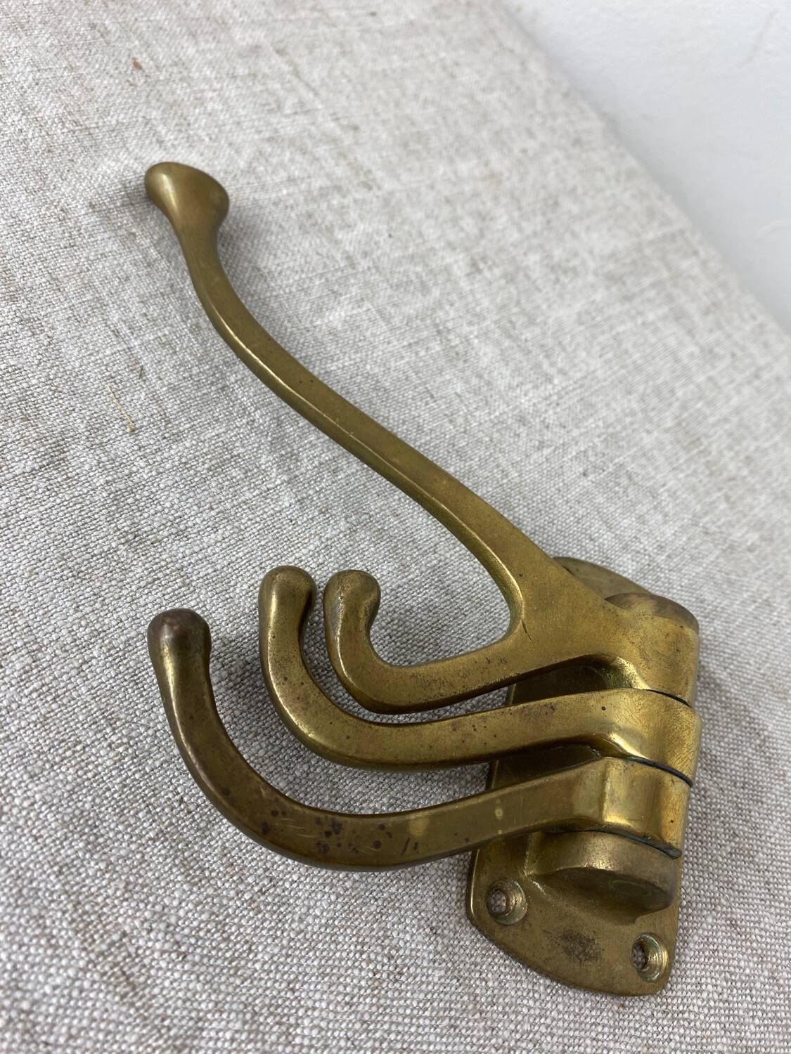 Three-pronged folding brass coat hook