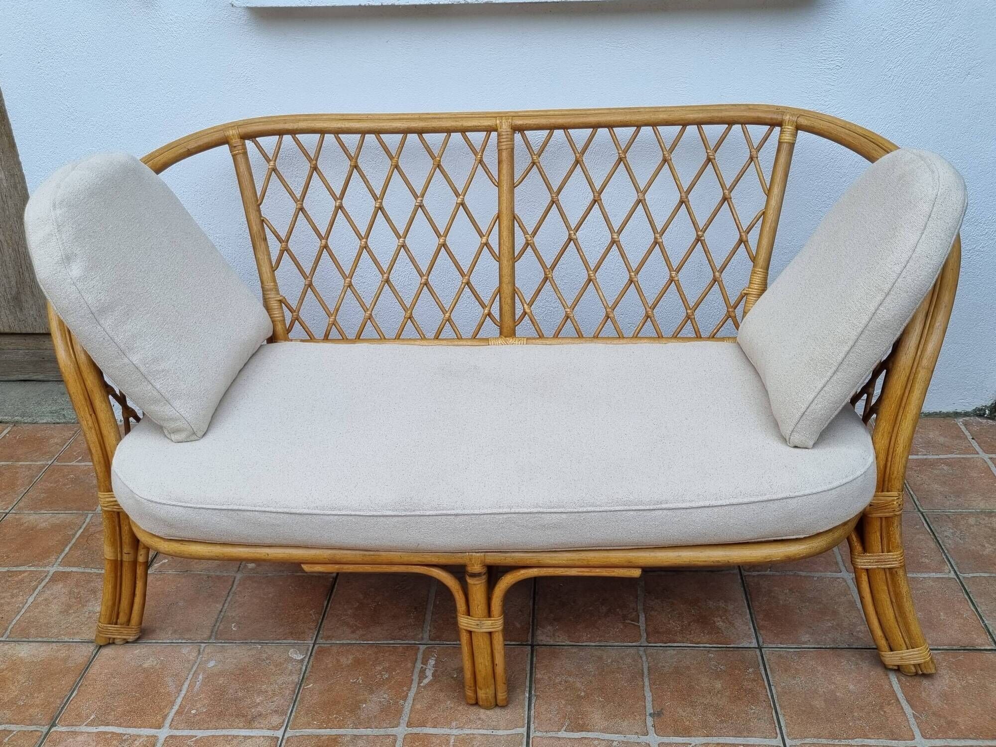Vintage two-seater natural rattan sofa with cotton cushions, 140 cm