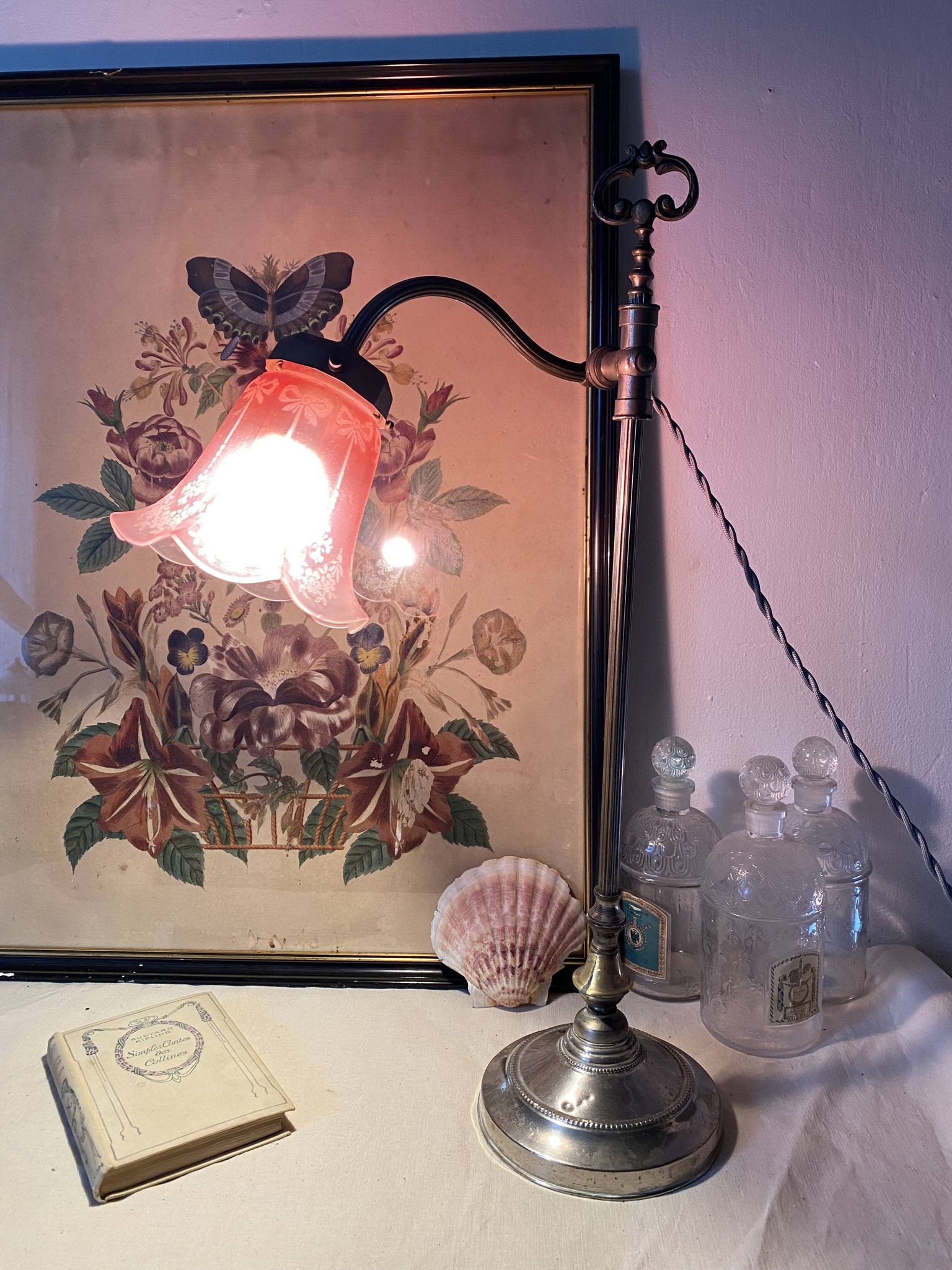 Antique jeweller's lamp, silver-plated base, frosted pink glass shade.