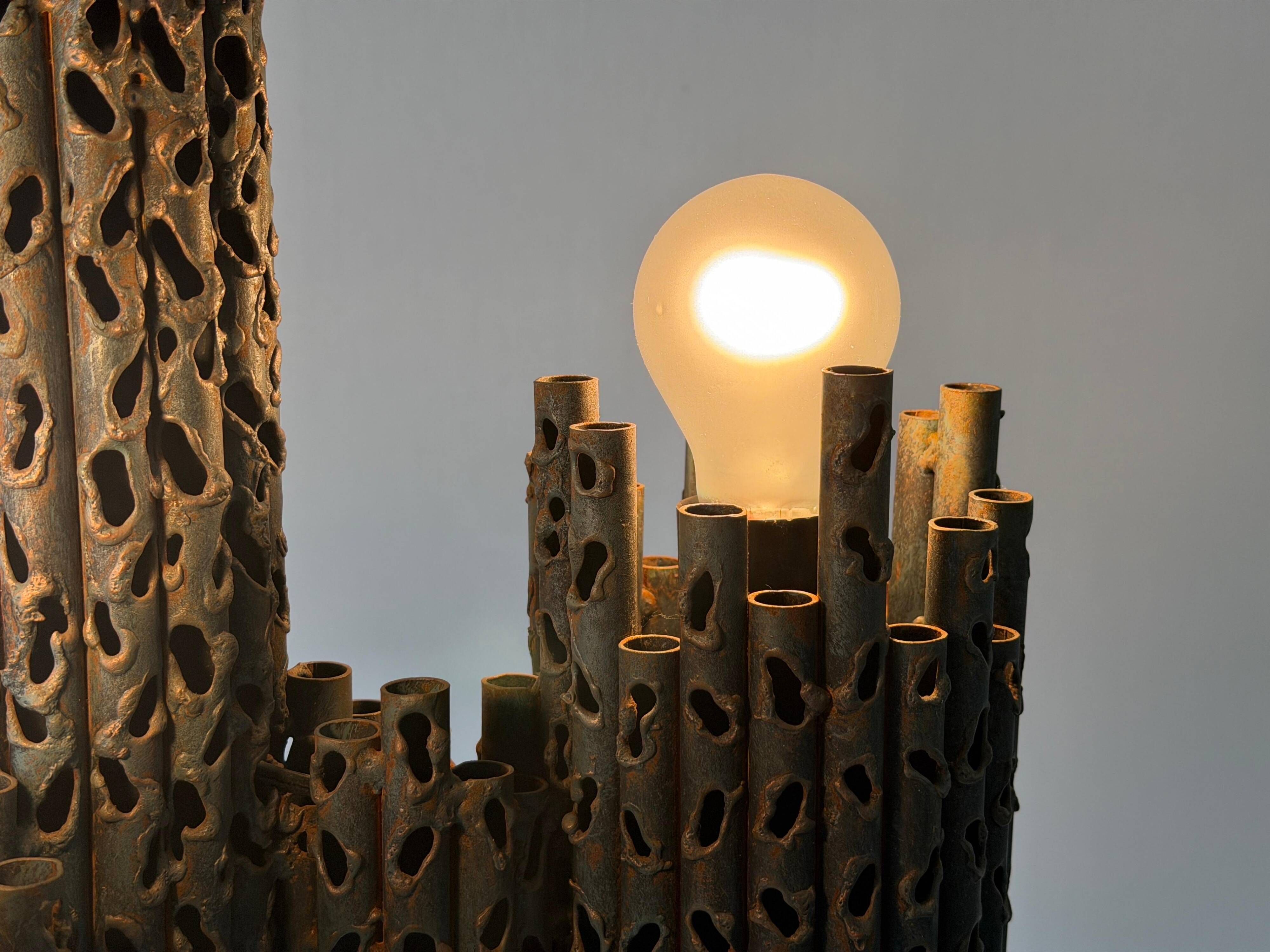 Three-armed suspended lamp in wrought iron, brutalist design, 1960s, Italy.