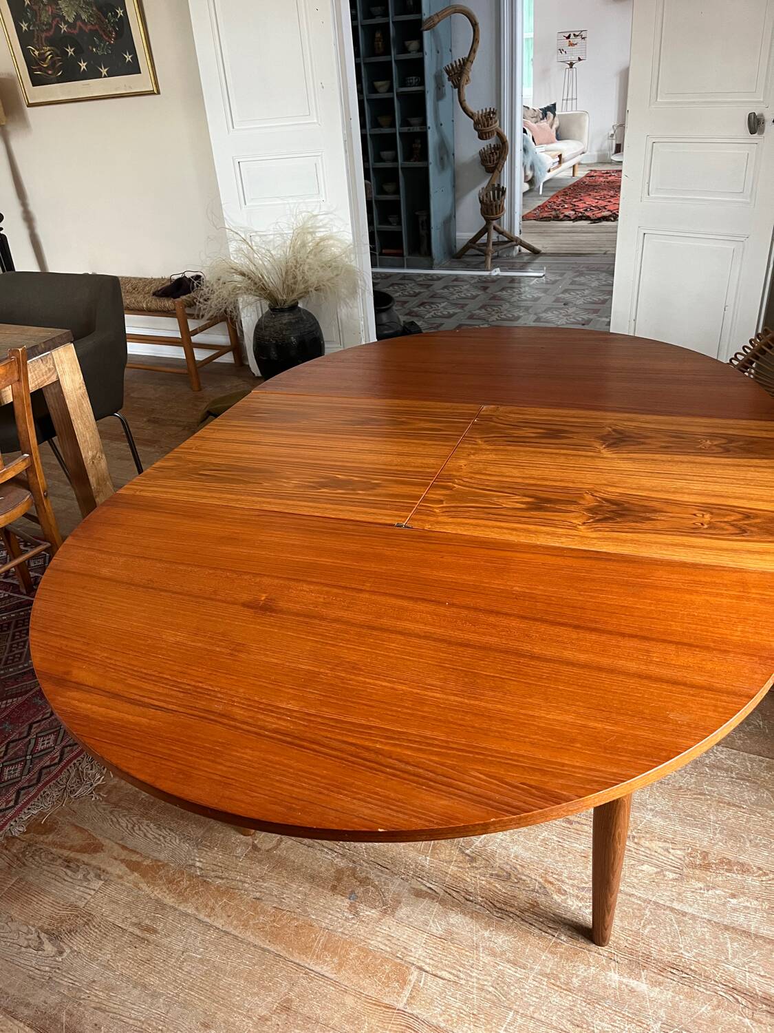 Scandinavian round teak table with butterfly extensions from the 60s