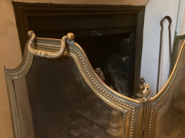 Old brass fire shield