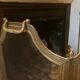 Old brass fire shield