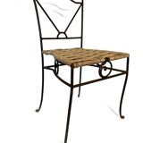 Wrought iron chair with woven seat