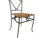 Wrought iron chair with woven seat