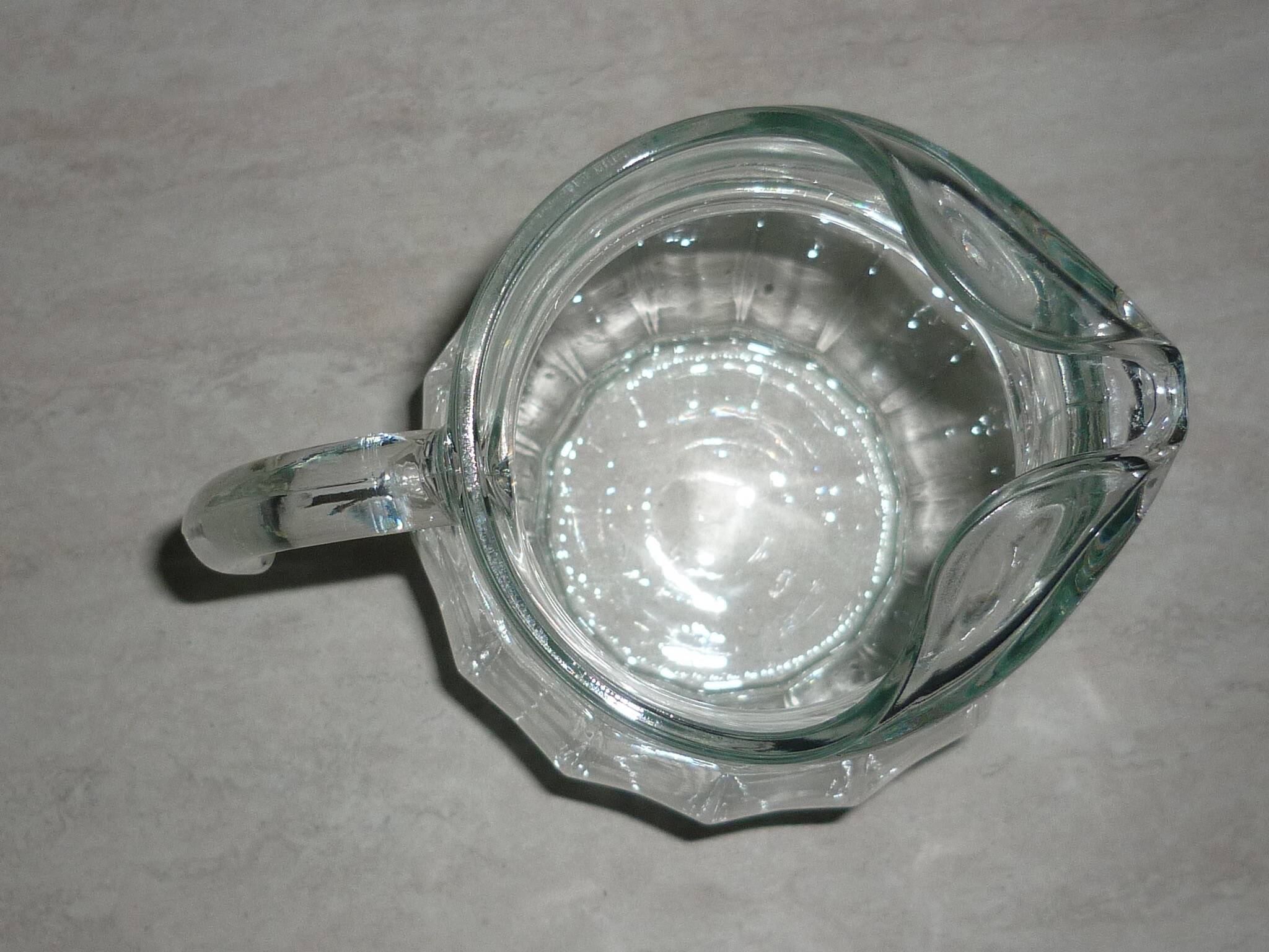 Vintage transparent molded glass carafe with handle