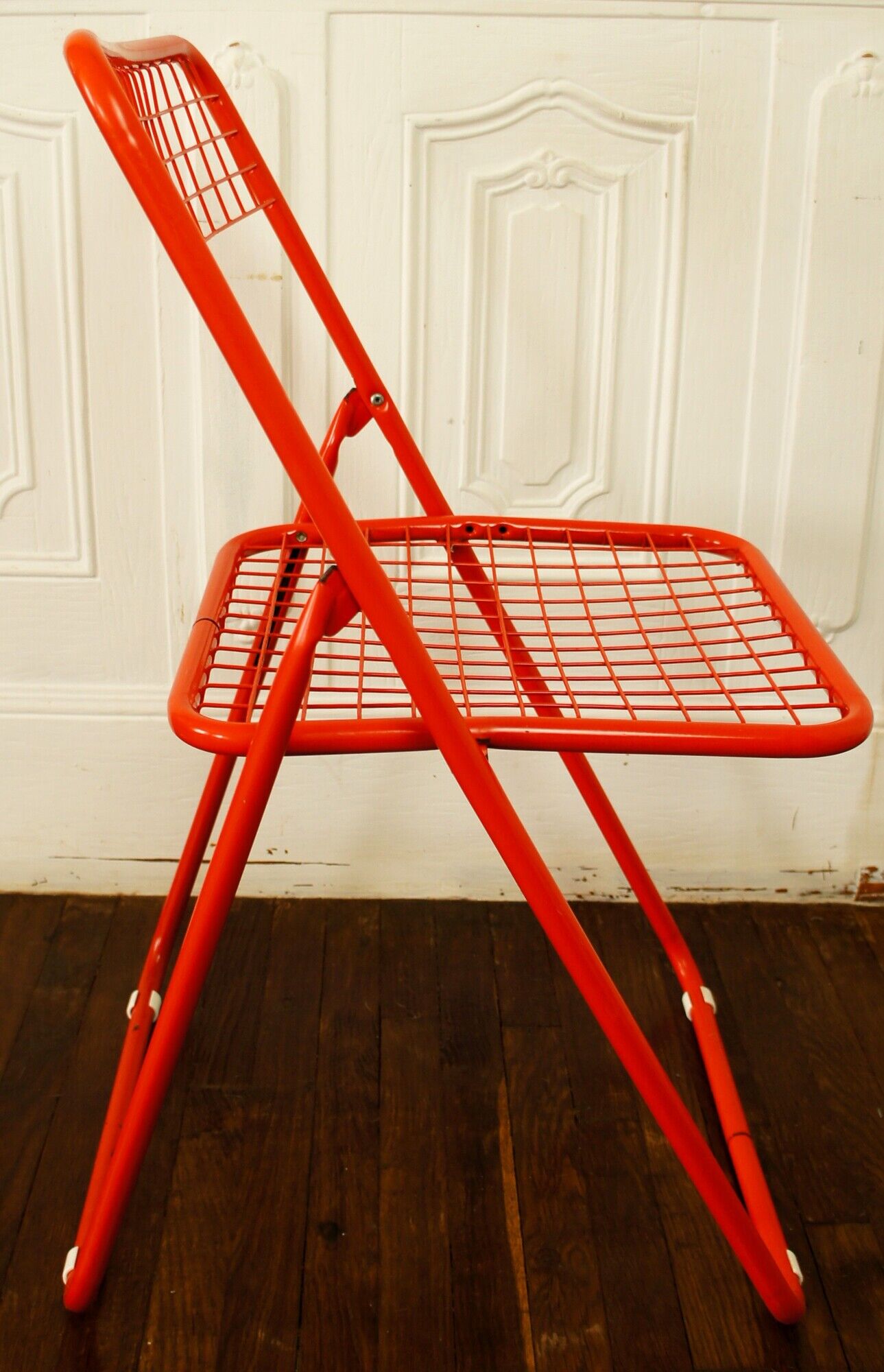 Red "grid" metal folding chair 1980