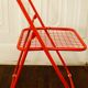 Red "grid" metal folding chair 1980