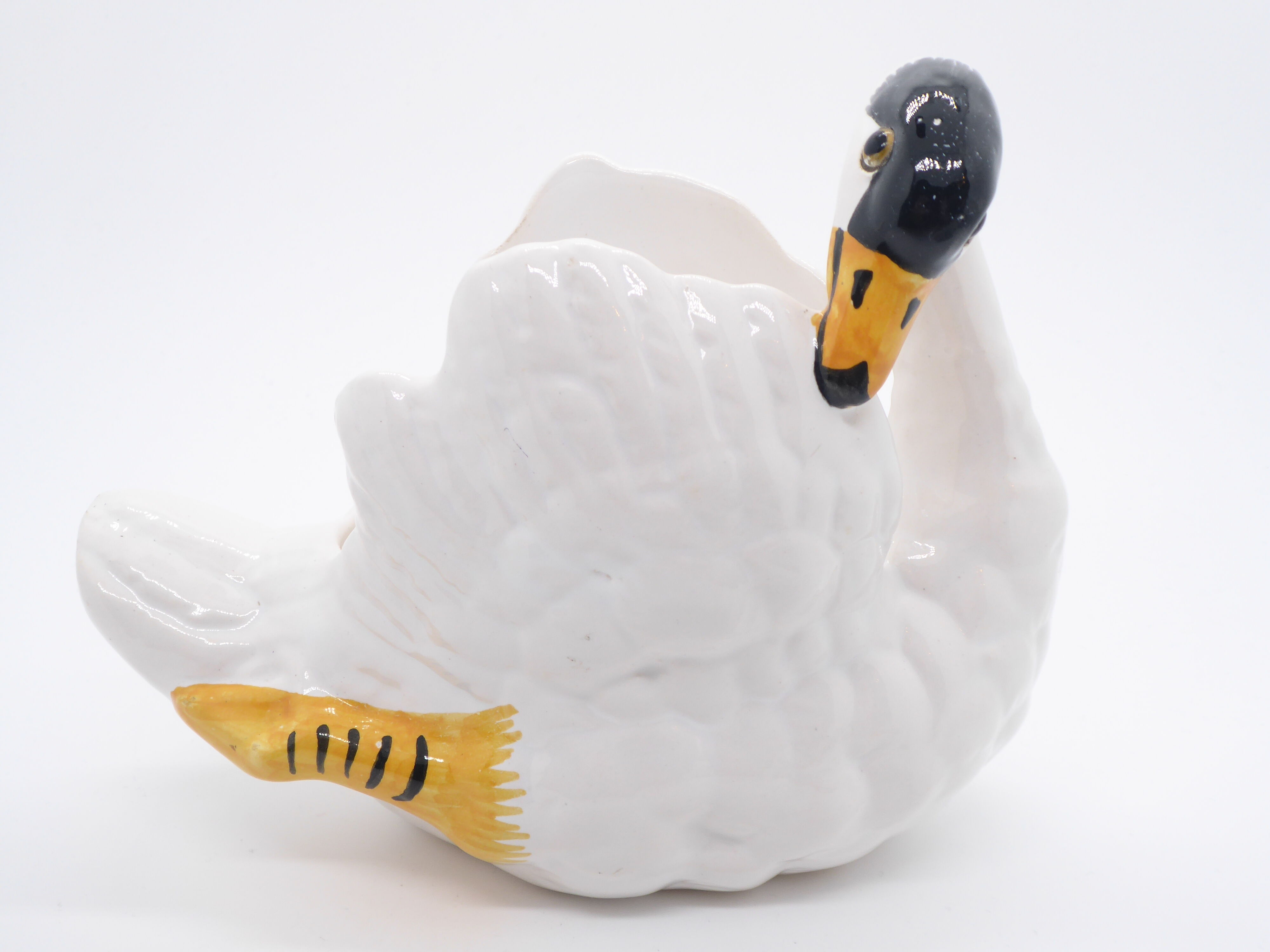 Ceramic pot cover in the shape of a swan