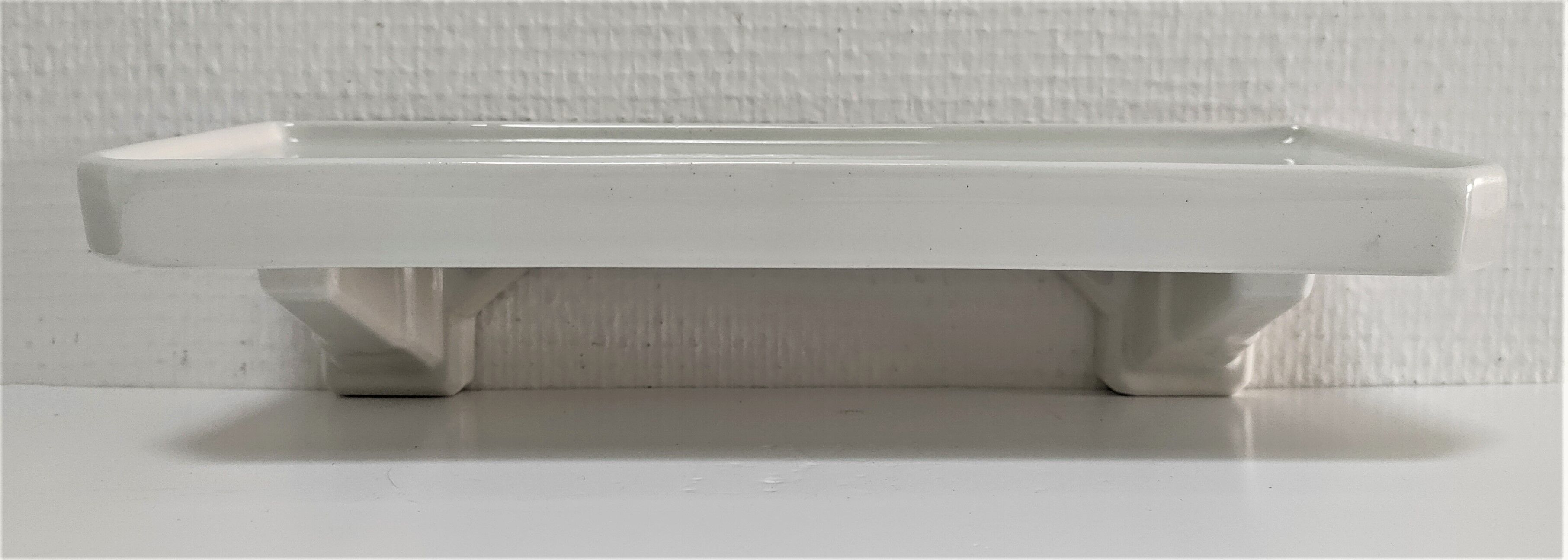 Art Deco white glazed ceramic wall shelf