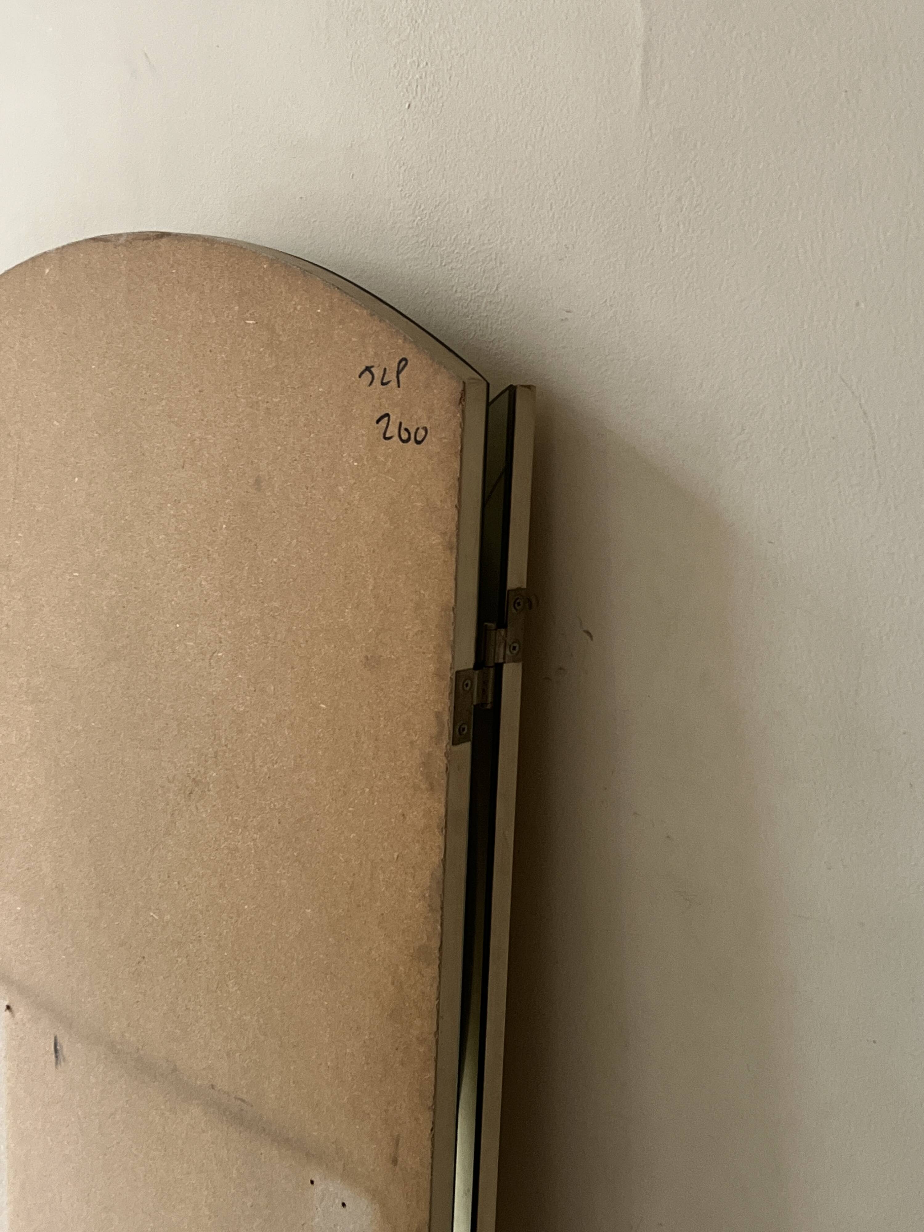 Large round triptych mirror with ivory background and back, 1970s design.