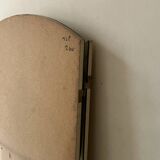 Large round triptych mirror with ivory background and back, 1970s design.