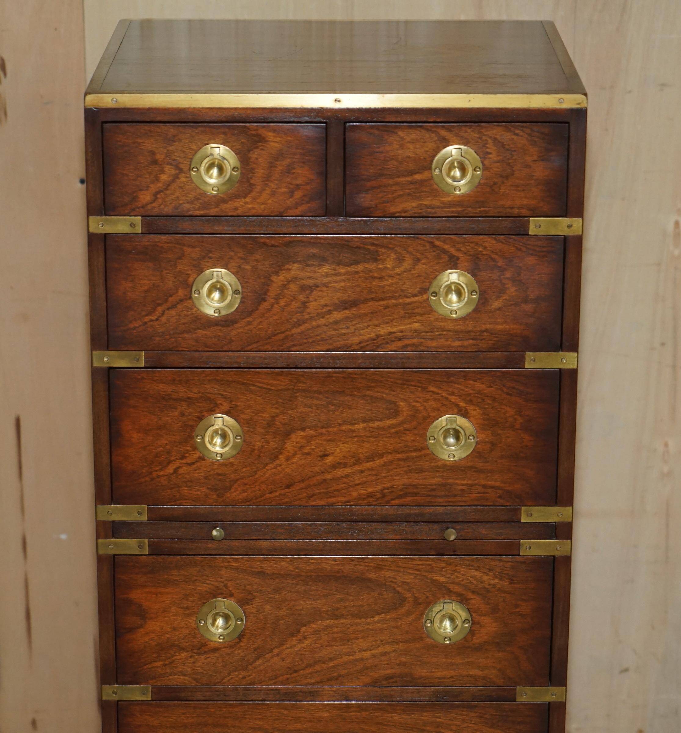 Pair of vintage military campaign high chests of drawers with leather tops.