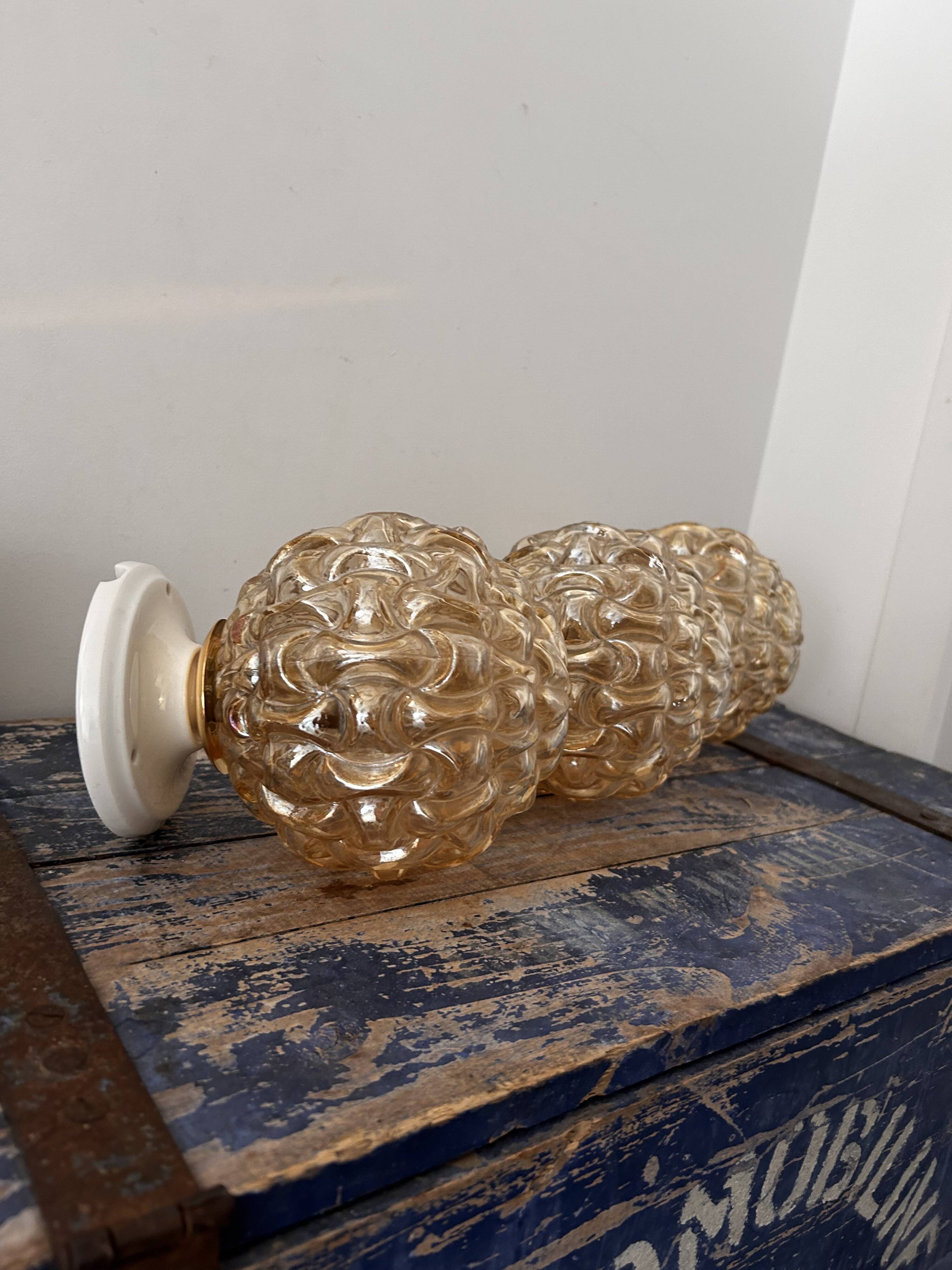 Trio of golden globe wall or ceiling lights