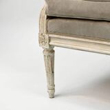 Louis XVI style canapé, in white lacquered wood.