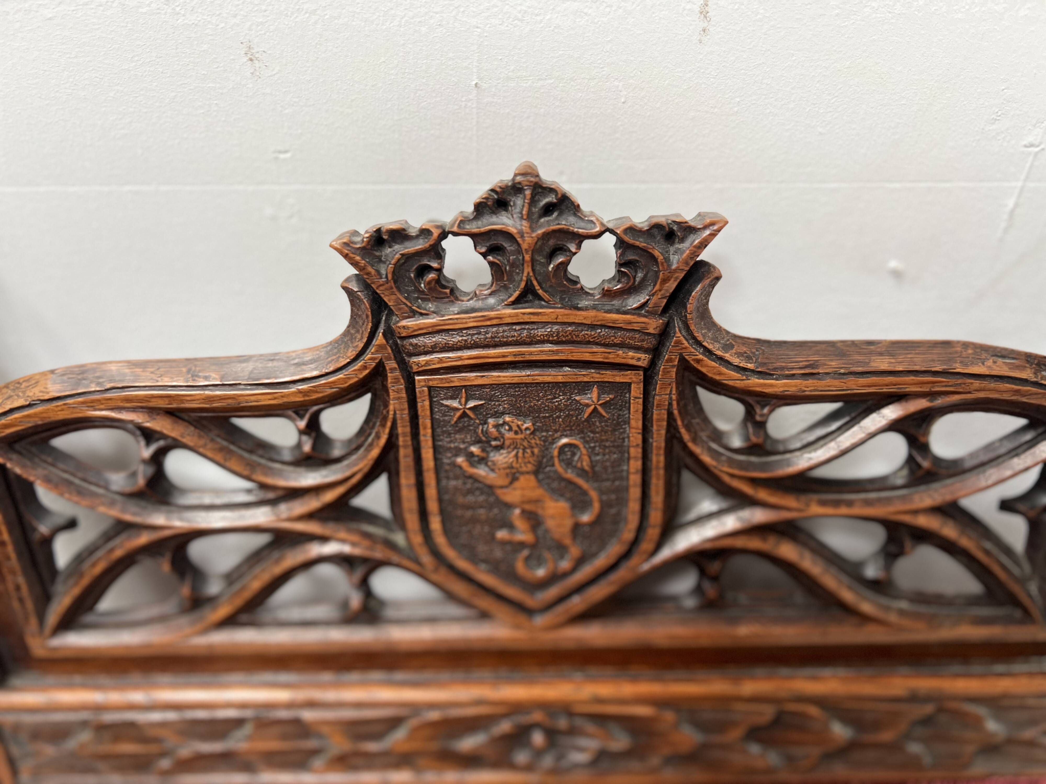 Pair of Gothic-style walnut lounge chairs, 19th century