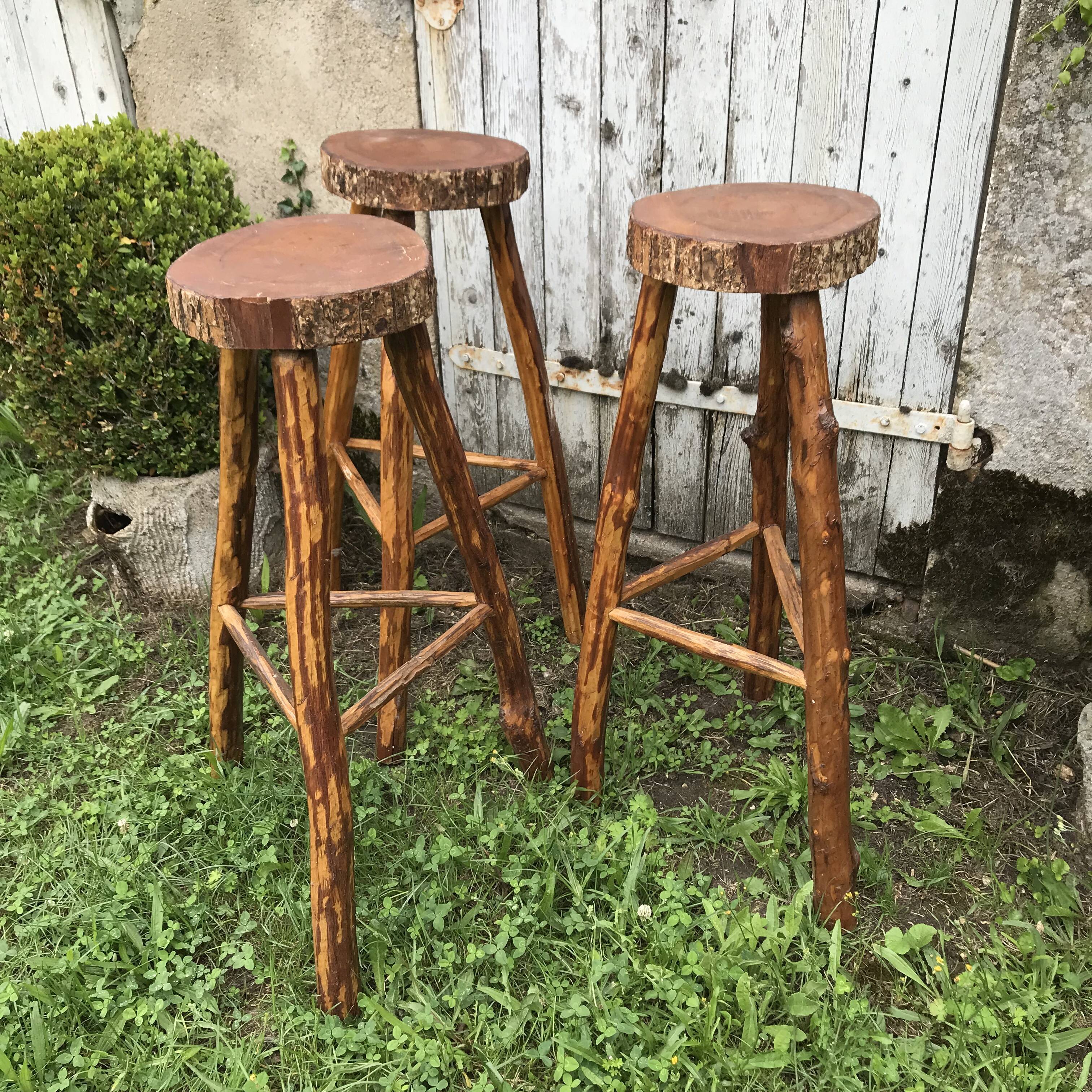 3 bar stools in rough wood