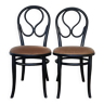 Vintage black Thonet chairs with velvet seats.