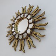 Golden wooden sun mirror with inlays from the early 20th century.