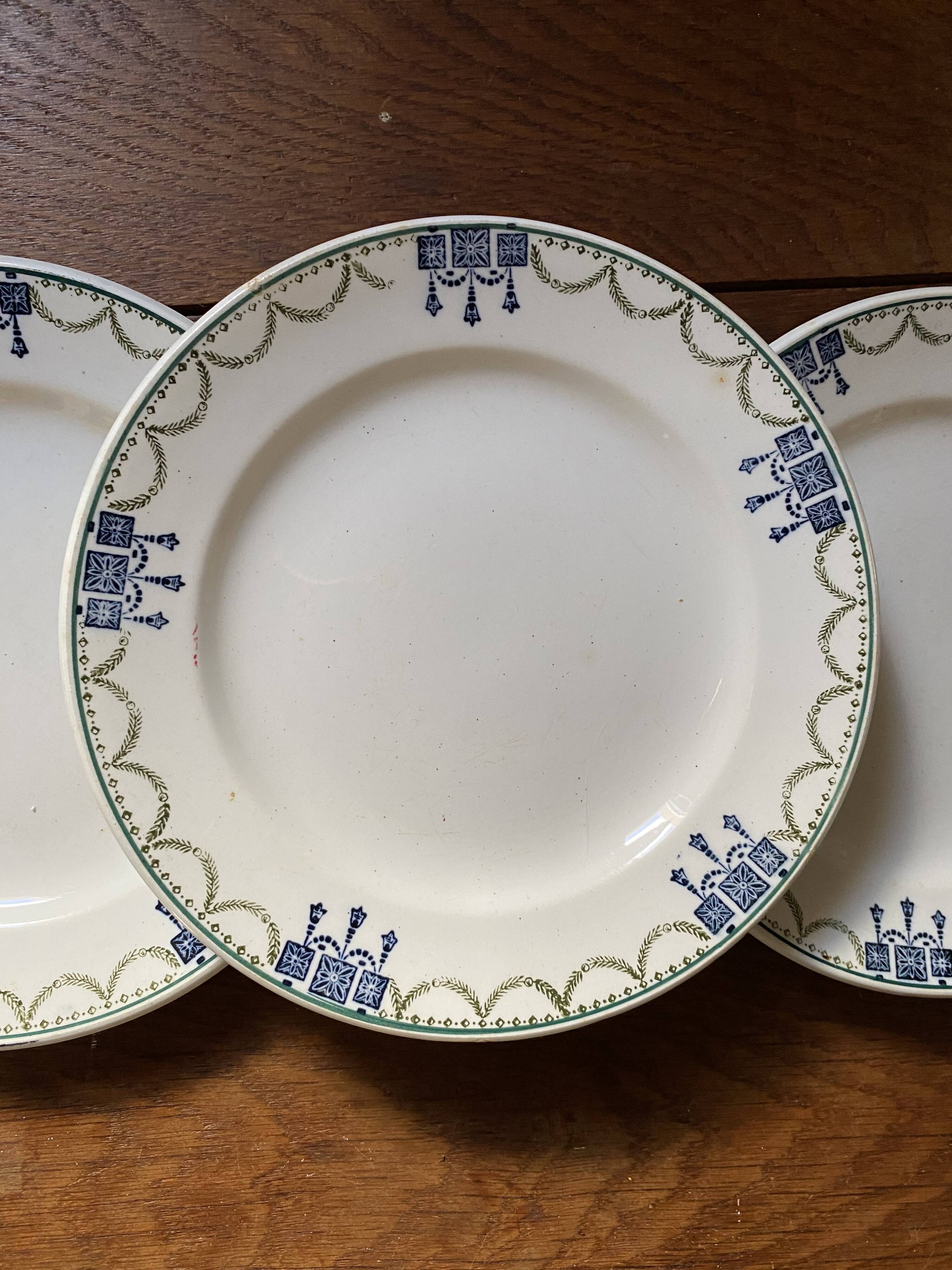 3 dessert plates stamped in art deco style.