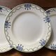 3 dessert plates stamped in art deco style.
