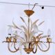 Vintage wrought iron chandelier decorated with golden and beige reeds