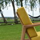 Scandinavian armchair, yellow fabric, natural wood