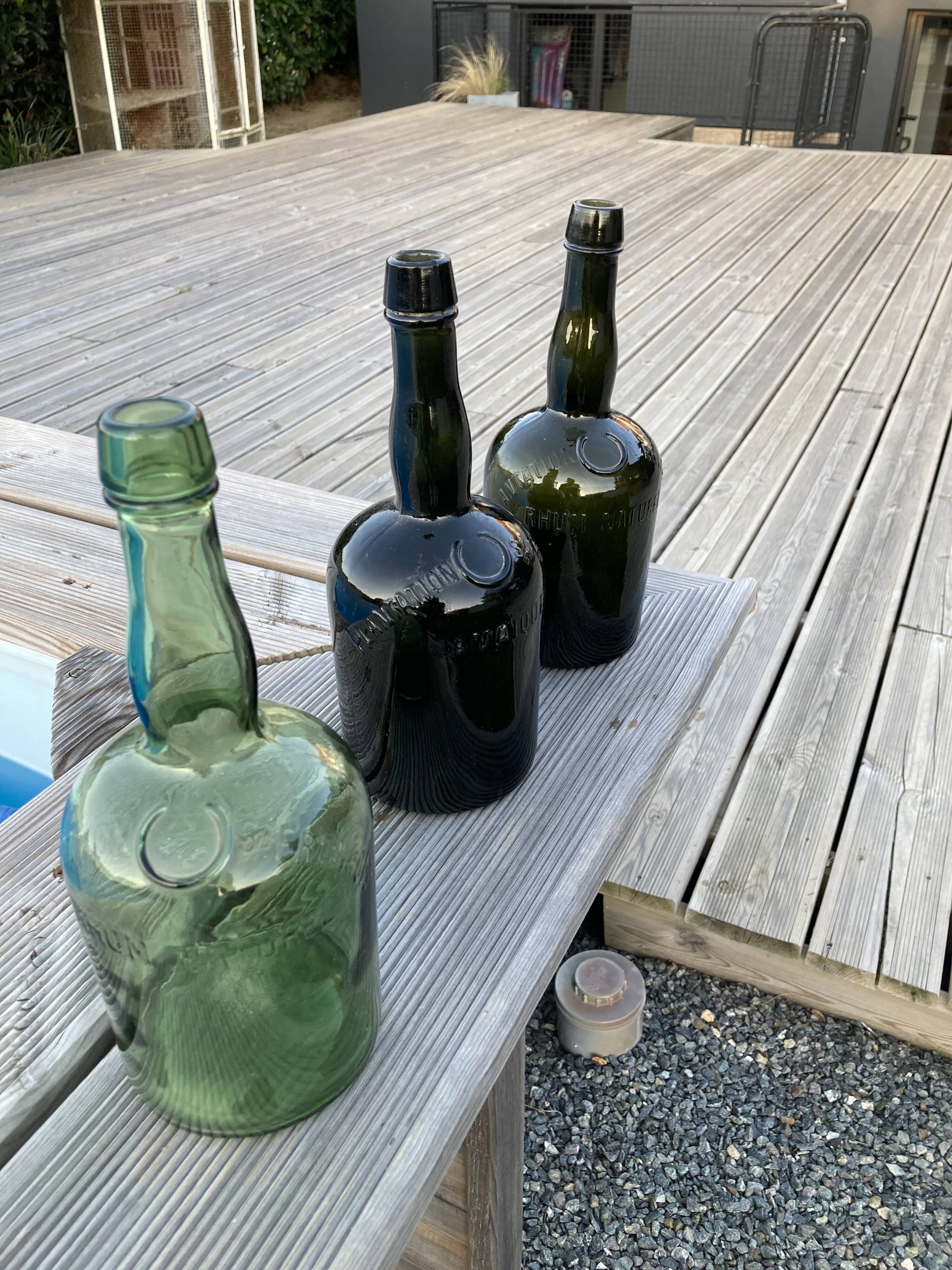 Set of three Vintage Rum Bottles