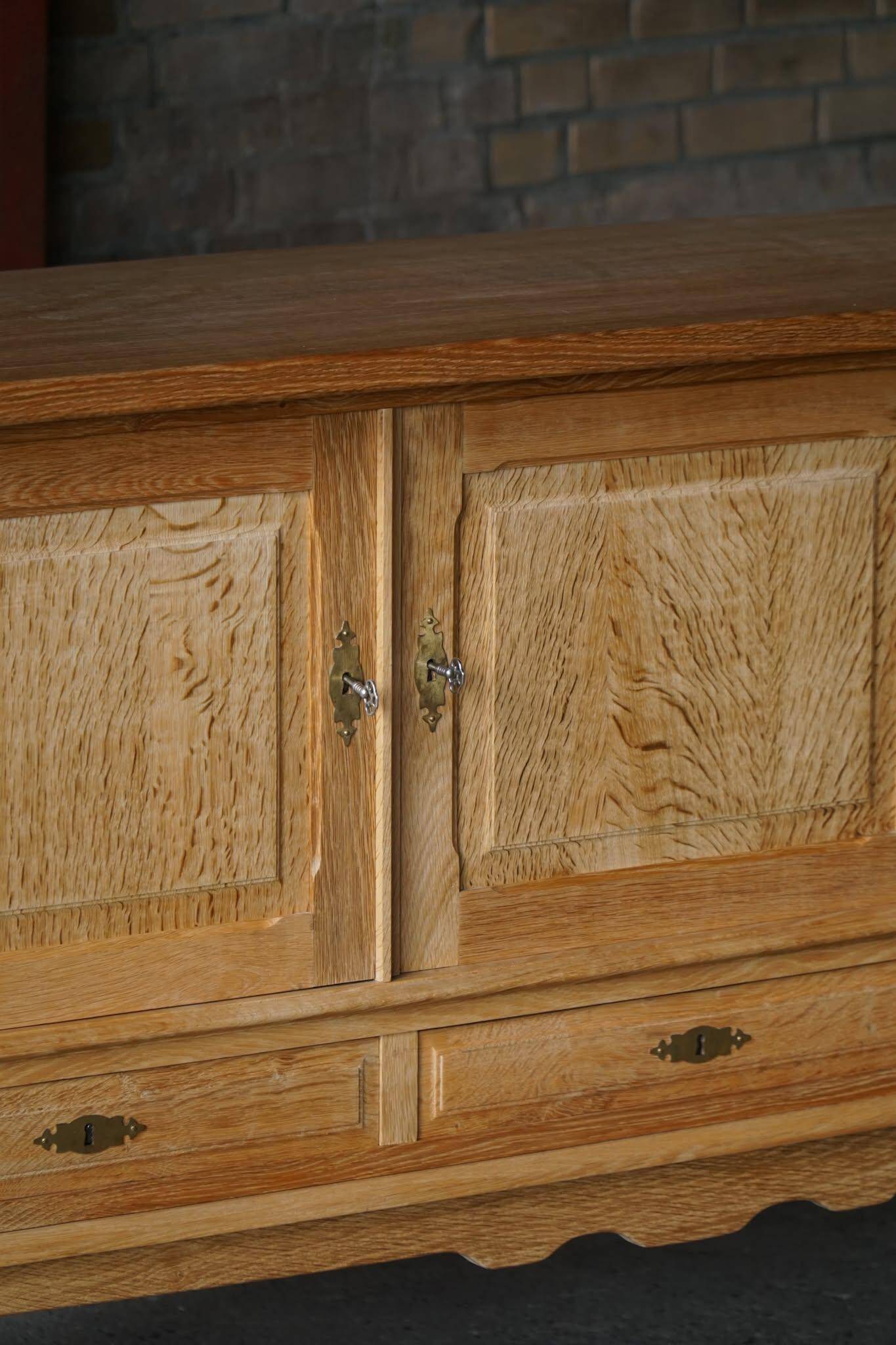 Brutalist Danish enfilade from the mid-century in oak by Henning Kjærnulf, 1960s.
