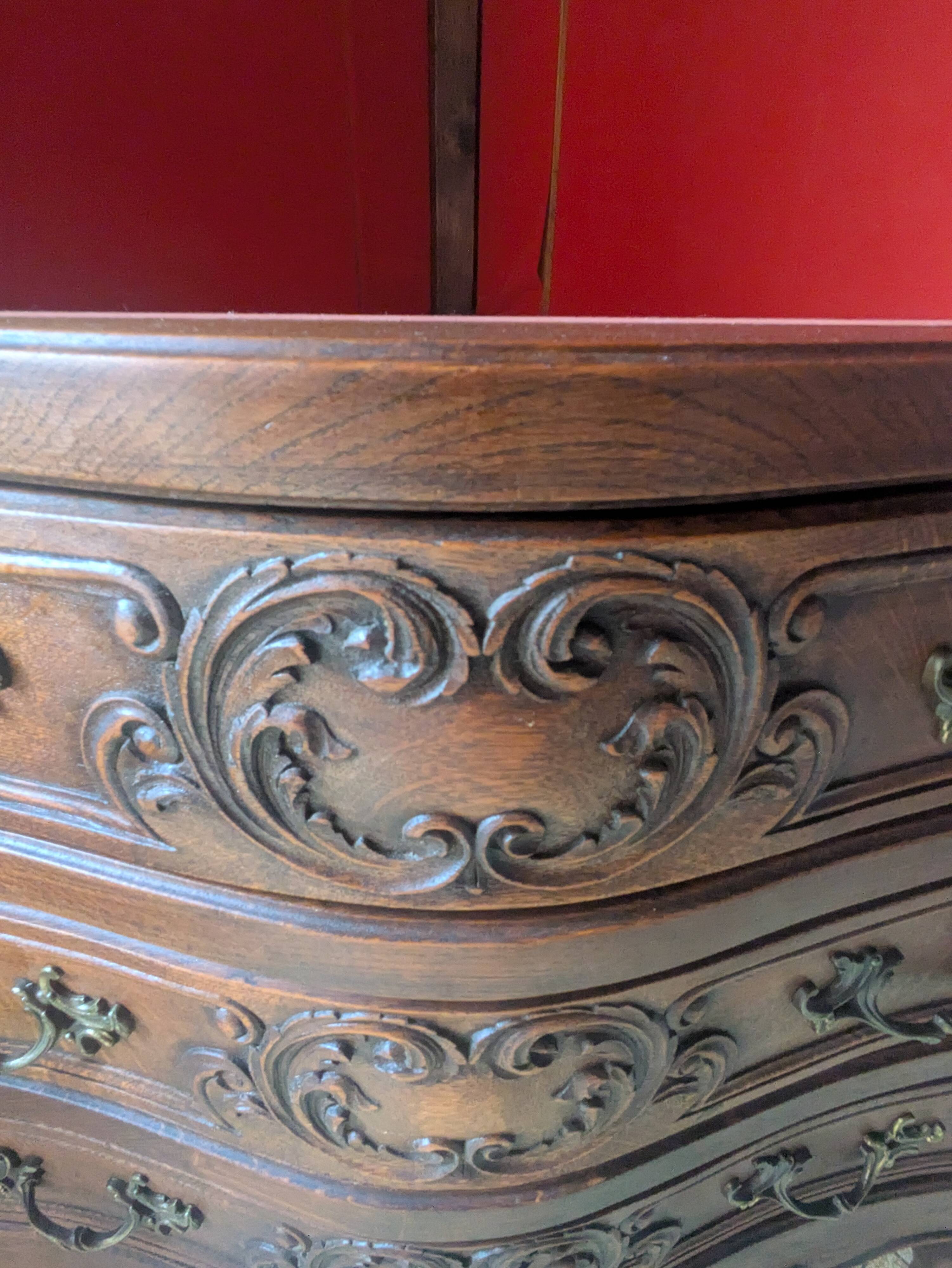 Antique corner cabinet in Louis XV style, topped with a marble surface.