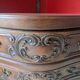 Antique corner cabinet in Louis XV style, topped with a marble surface.