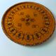 Round top in carved wood and vintage varnish