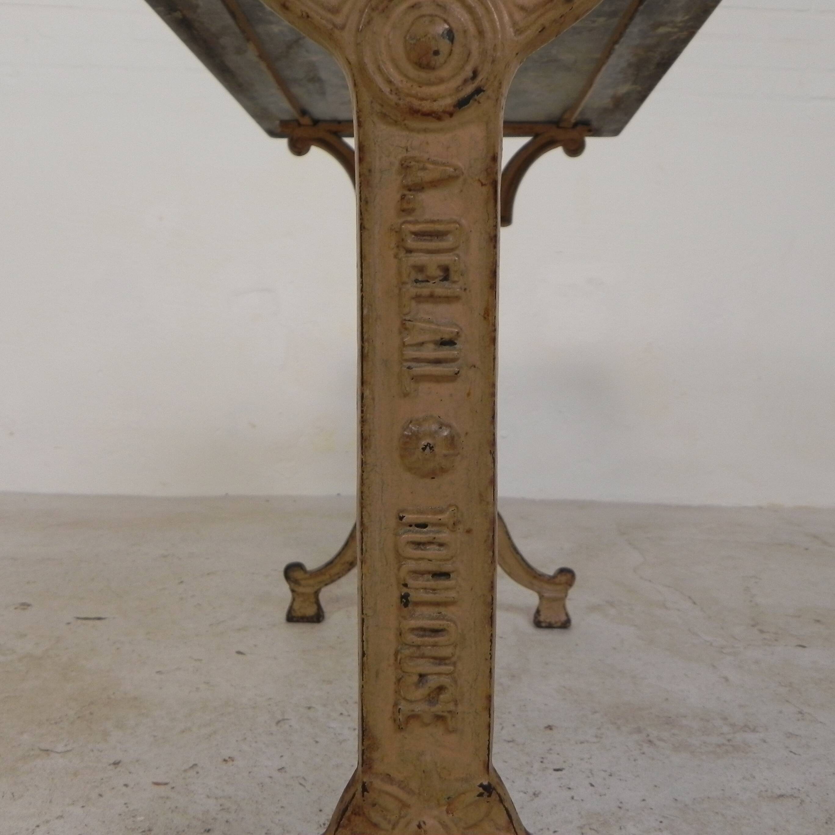 Bistro table marked A.Delail Toulouse in cast iron and marble, 1920