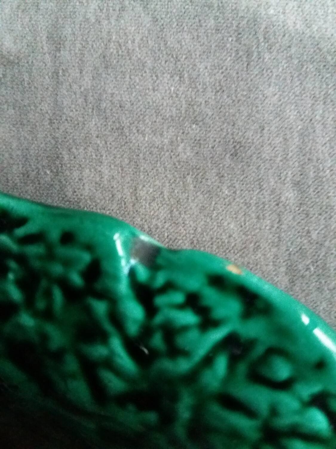 Large dish in green cabbage leaf slip