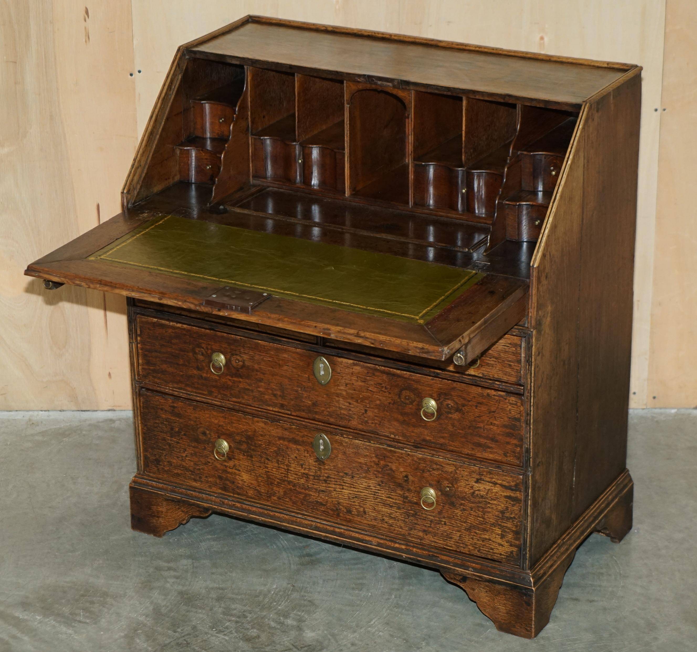 Ancient Georgian writing desk circa 1760 with a leather top.