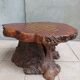 Brutalist chessboard coffee table made from tree stump.