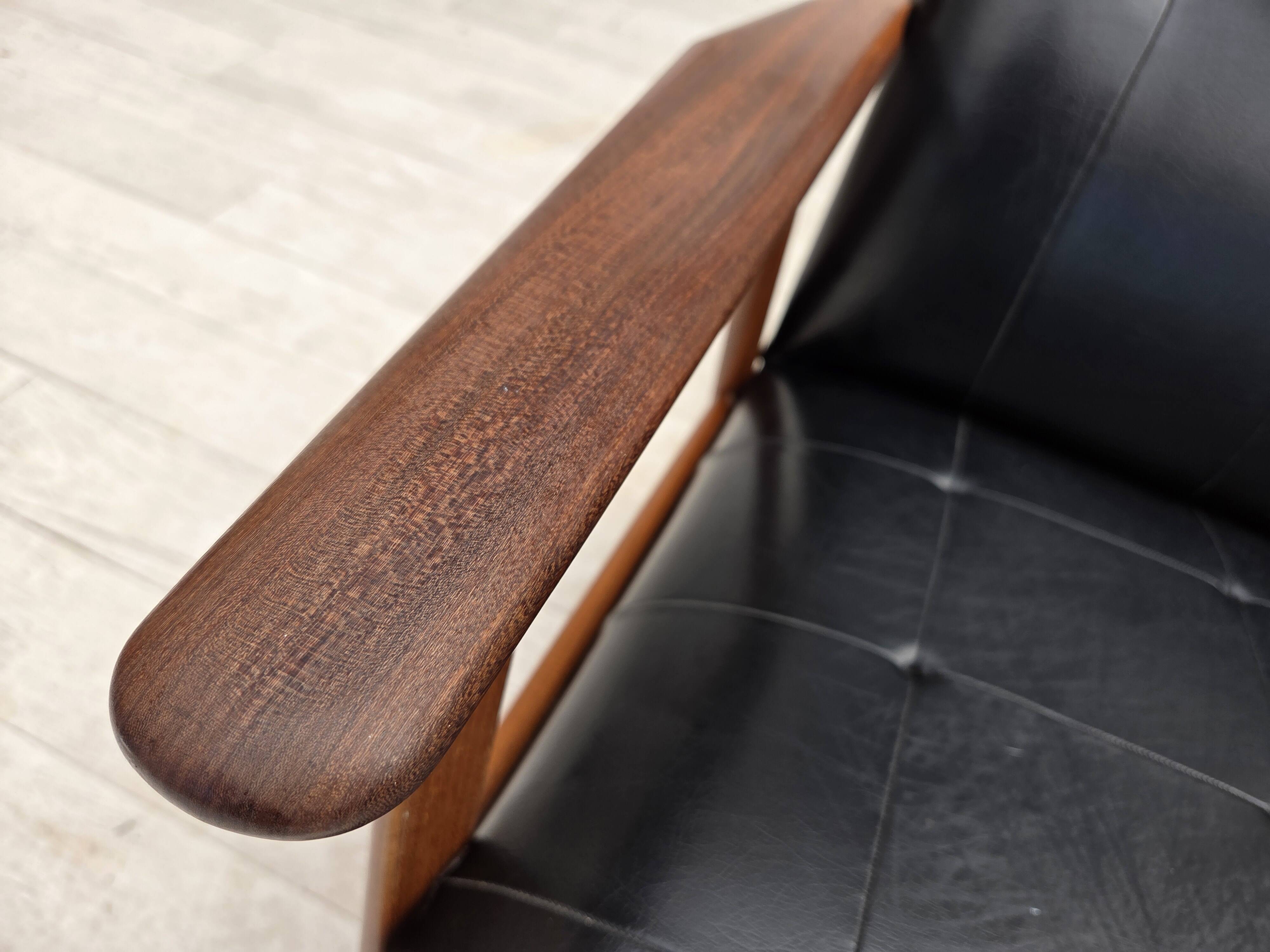 1970s, Danish armchair, black artificial leather, teak wood.