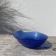 Blue glass shell emptier