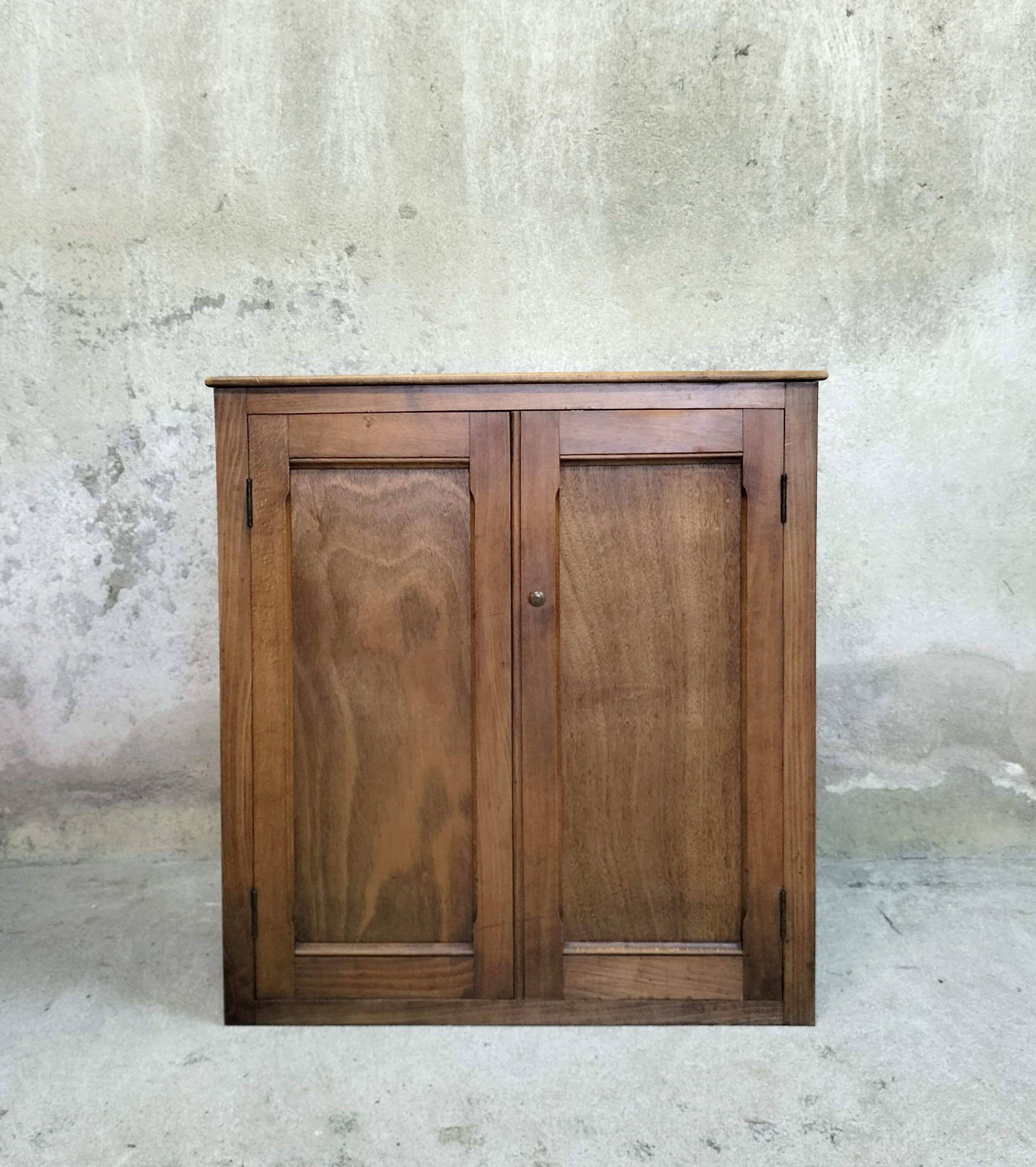 Small wooden sideboard with two doors.