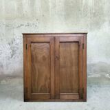 Small wooden sideboard with two doors.