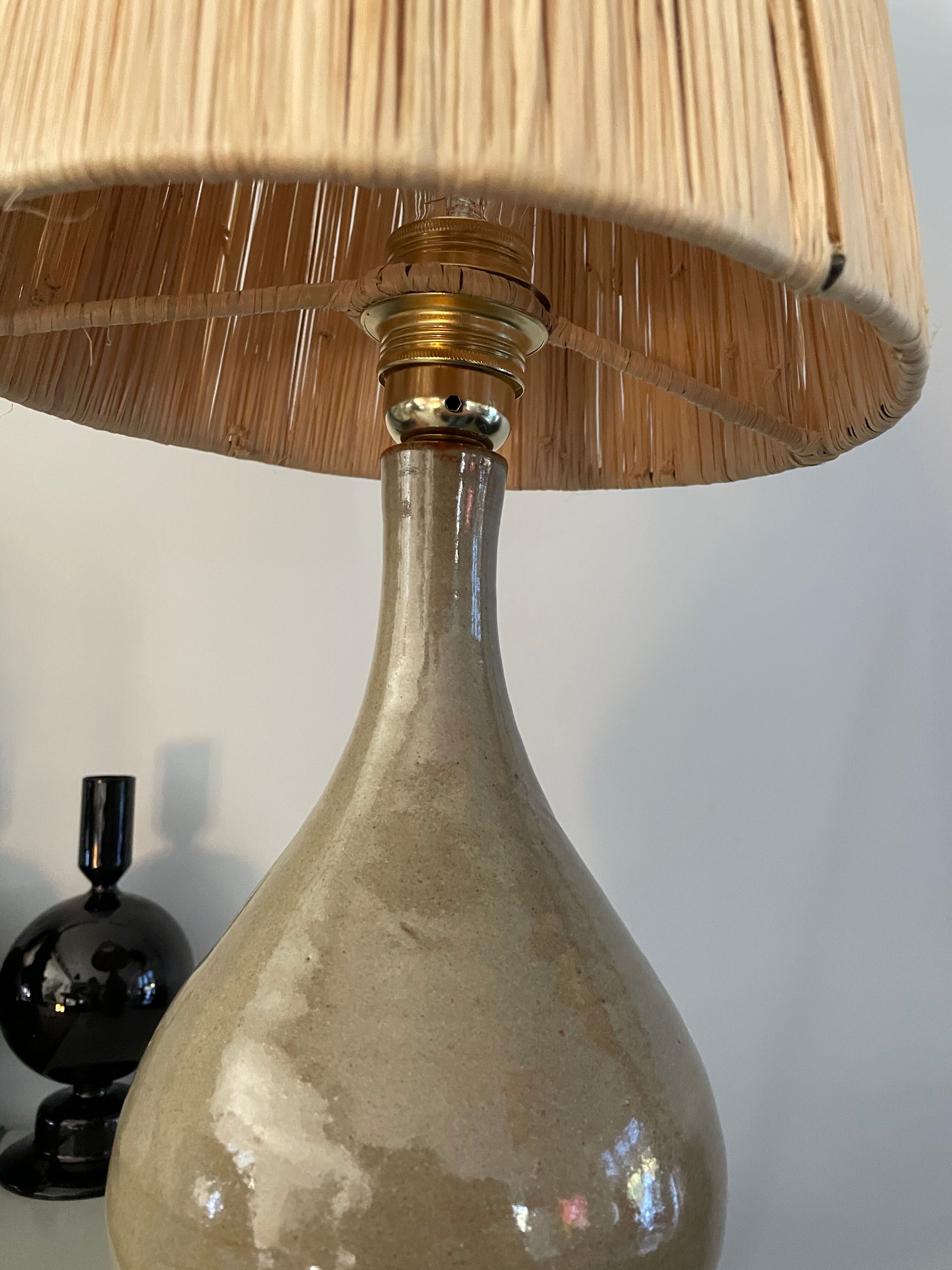 Lamp in stoneware and raffia electrified to nine
