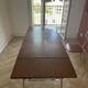 Vintage extendable kitchen table with wood effect Formica and chrome legs.
